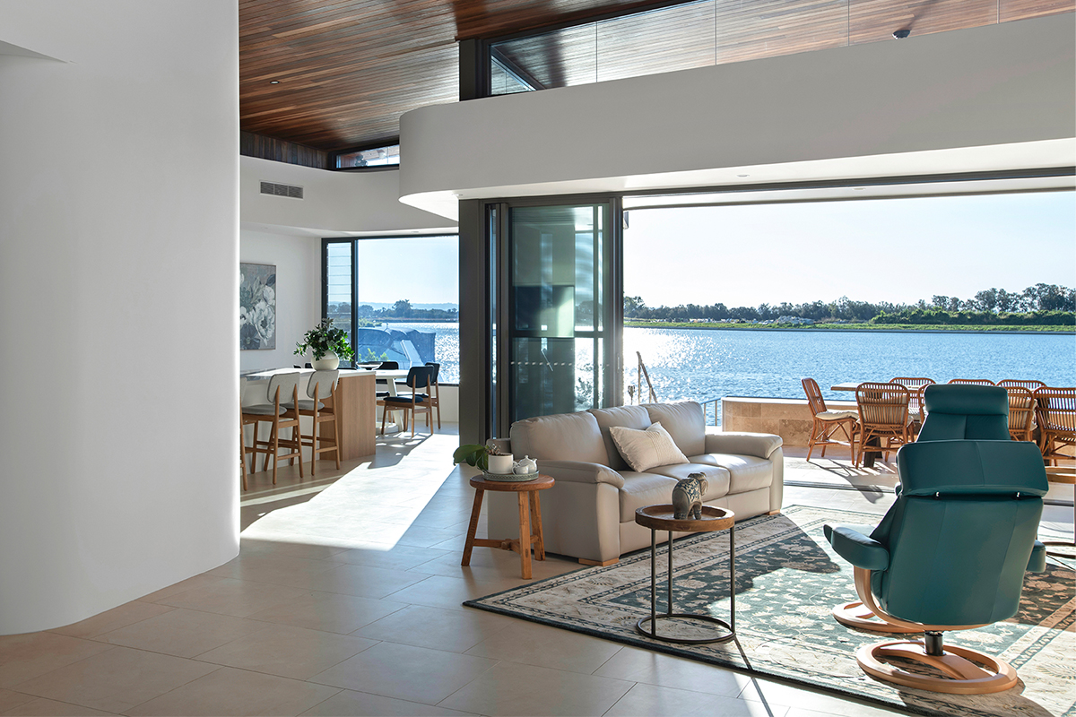 Interior shot of The Newport Residence showing waterfront view and curved walls